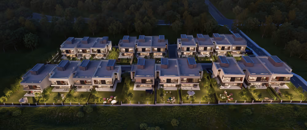 Aerial night view of the complete Aster Residence community