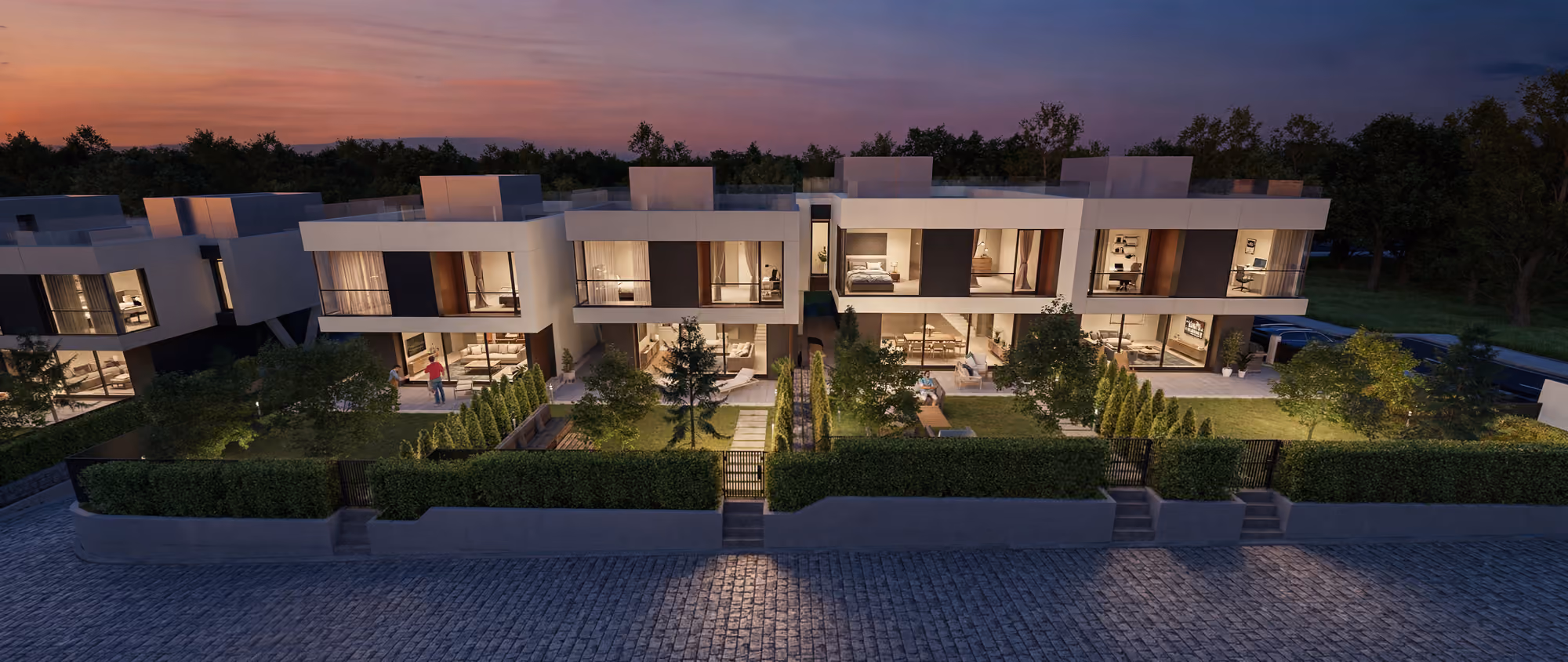 Evening view of the townhouses and landscaped entrances